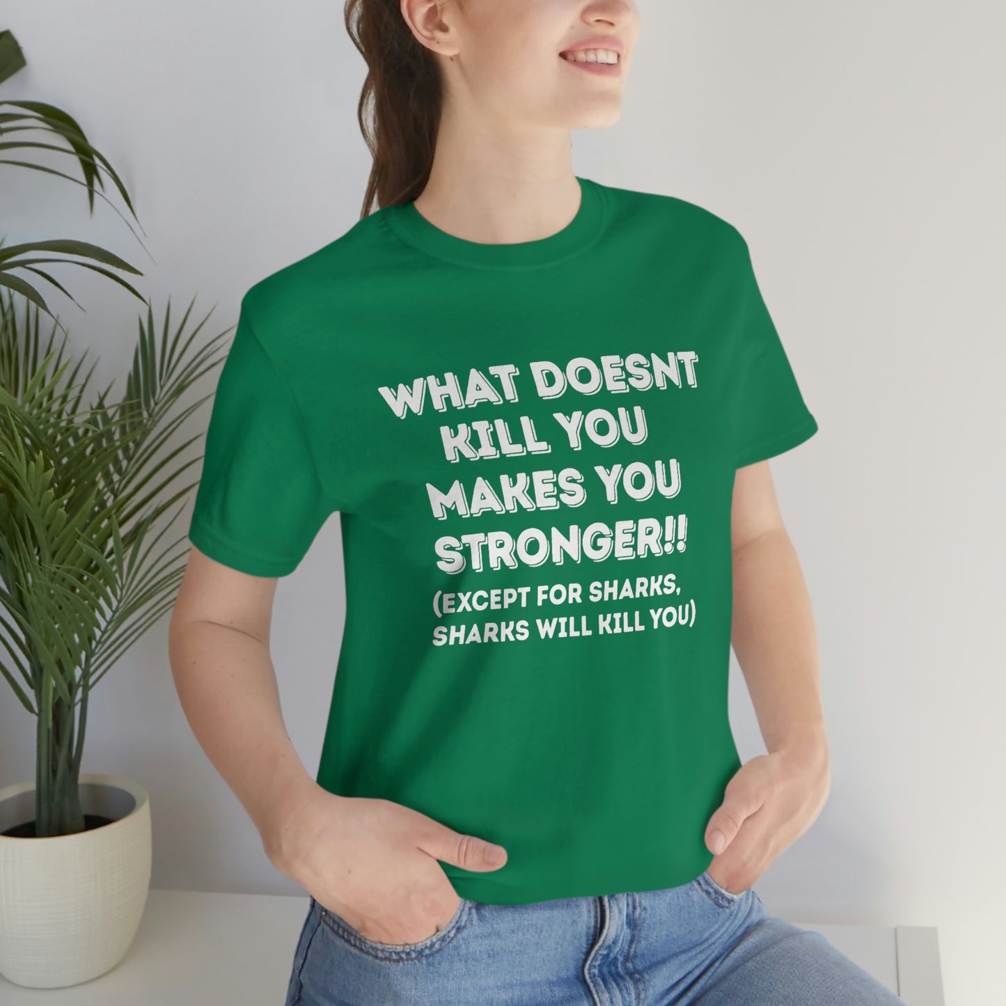 "What doesn't kill you makes you stronger, except sharks, sharks will kill you" - Regular Cotton - Unisex Jersey Short Sleeve Tee (Bella+Canvas 3001)